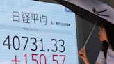 Stock market today: Asian shares are mostly higher after Wall Street hits more records