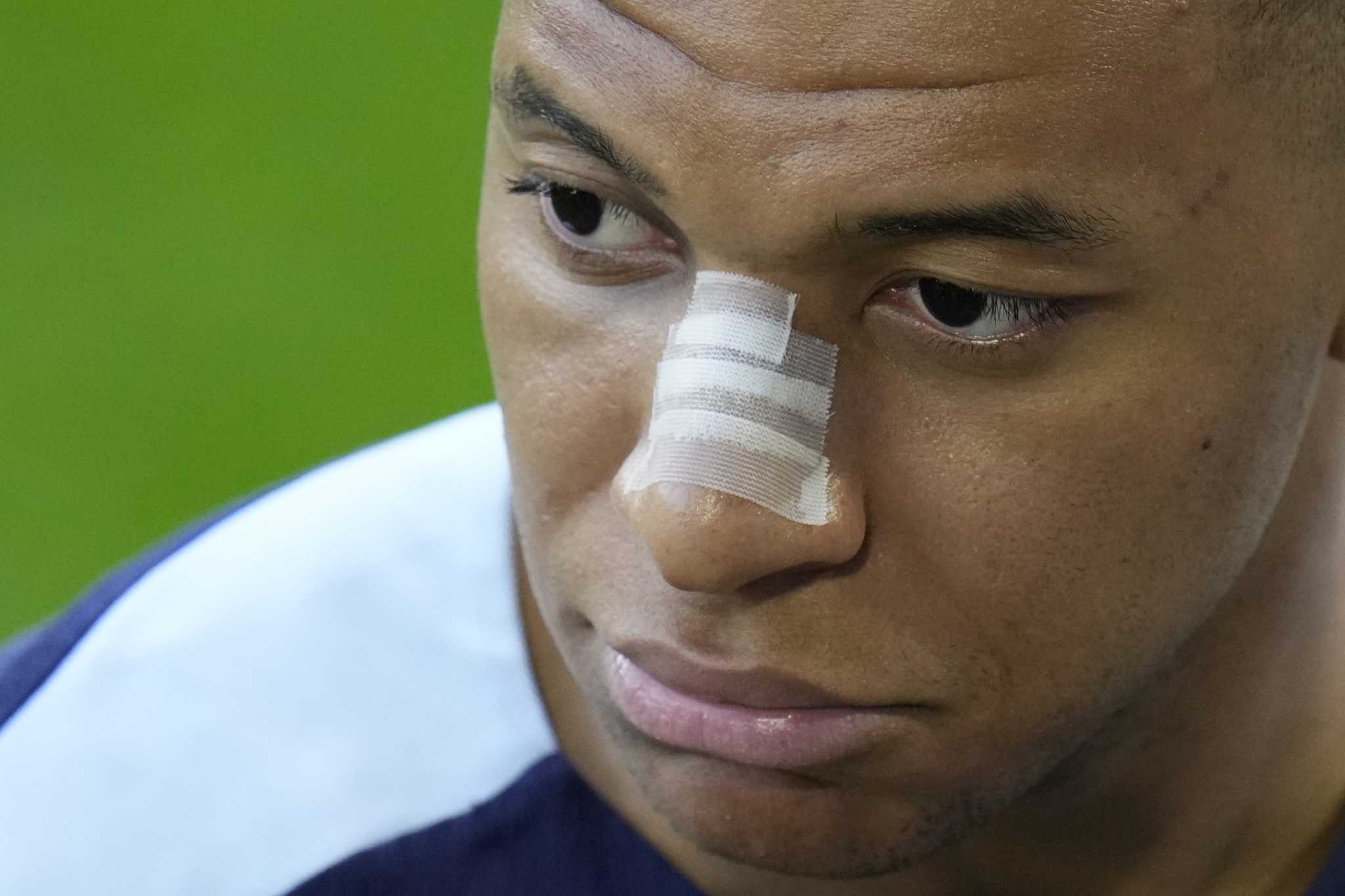 Kylian Mbappé trains at Euro 2024 with bandage on broken nose and social media post causing intrigue