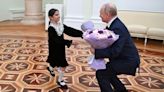 In Kremlin stunt, Putin and girl, 8, lobby minister for budget funds