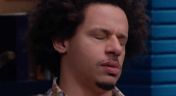 19. Eric Andre Wears a Cat Collage Shirt & Sneakers