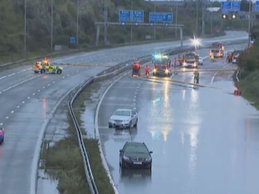 Motorway delays as drivers trapped by floodwater | ITV News