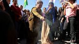 In Syrian north, women protest over death of Iran's Amini