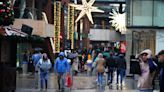 Last-minute shoppers hit the streets on Christmas Eve