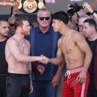 Saul Alvarez and challenger Jaime Munguia shake hands at the weigh-in for their all-Mexican super middleweight world title bout in Las Vegas