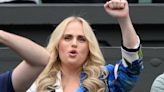 Rebel Wilson shows off her ample cleavage in a smart suit at Wimbledon