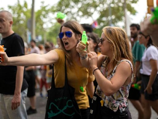 Barcelona anti-tourism protesters fire water pistols at visitors