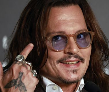 Johnny Depp parties in the Caribbean, but no longer has teeth of a pirate