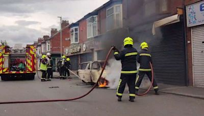 Locals say 'it's like Beirut' as 200 guard mosque in Middlesbrough riots