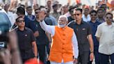 Modi's party well ahead in Indian elections in early vote count but opposition stiffer than expected