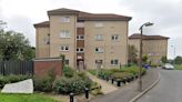 Woman dies in hospital after plunging from window at block of flats in Irvine.