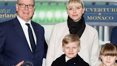 Princess Charlene wows in knee-high boots for rare outing with twins