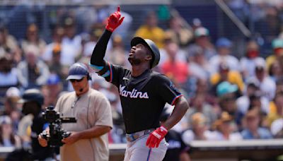 Garrett outlasts Darvish and the Marlins beat the Padres 9-1 behind season-high 16 hits