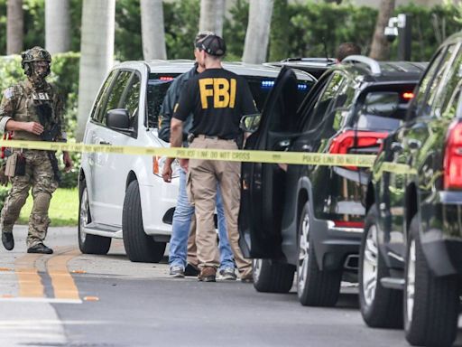 Medical examiner arrives at developer Sergio Pino’s street after FBI activity, loud bangs