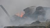 London fire crews continue to deal with stubborn hay fire