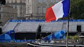 Thousands of fans take place along River Seine for rainy Olympic opening ceremony