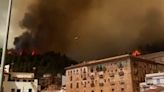 Thick smoke clouds fill sky as hundreds of firefighters tackle Spanish wildfire
