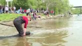 Manitowoc conservationists release Coho Salmon into Lake Michigan to fight an invasive species