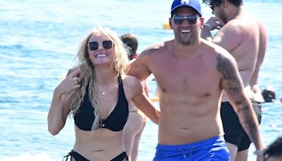 Katie McGlynn shares a kiss with boyfriend Ricky Rayment in Greece