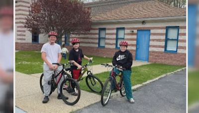 Three West Warwick boys receive new bikes and helmets after car accident