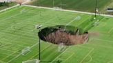 Huge sinkhole '100ft deep' opens up in middle of Illinois football pitch