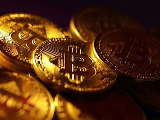 Bitcoin slides to four-month lows, ether sinks 8%