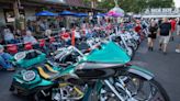 A Joker-themed motorcycle, one with a dog carrier turn heads at Myrtle Beach Bike Rally