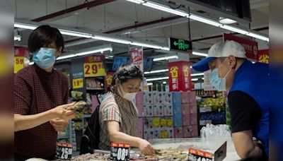 China consumer prices eke out gains as deflation pressure lingers - CNBC TV18