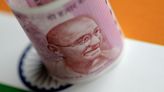 Indian rupee slips on dollar strength, marks weekly gain