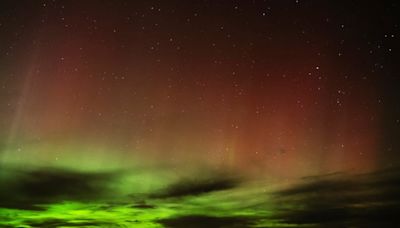 A solar storm is hitting Earth this weekend, bringing views of the northern lights to the U.S.
