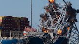 Collapsed Baltimore bridge span comes down with a boom after crews set off chain of explosives