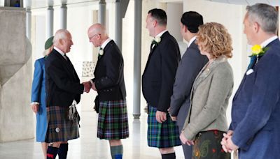 King Charles hails 'uniquely special' Scotland as it marks Holyrood milestone - before being hugged by woman