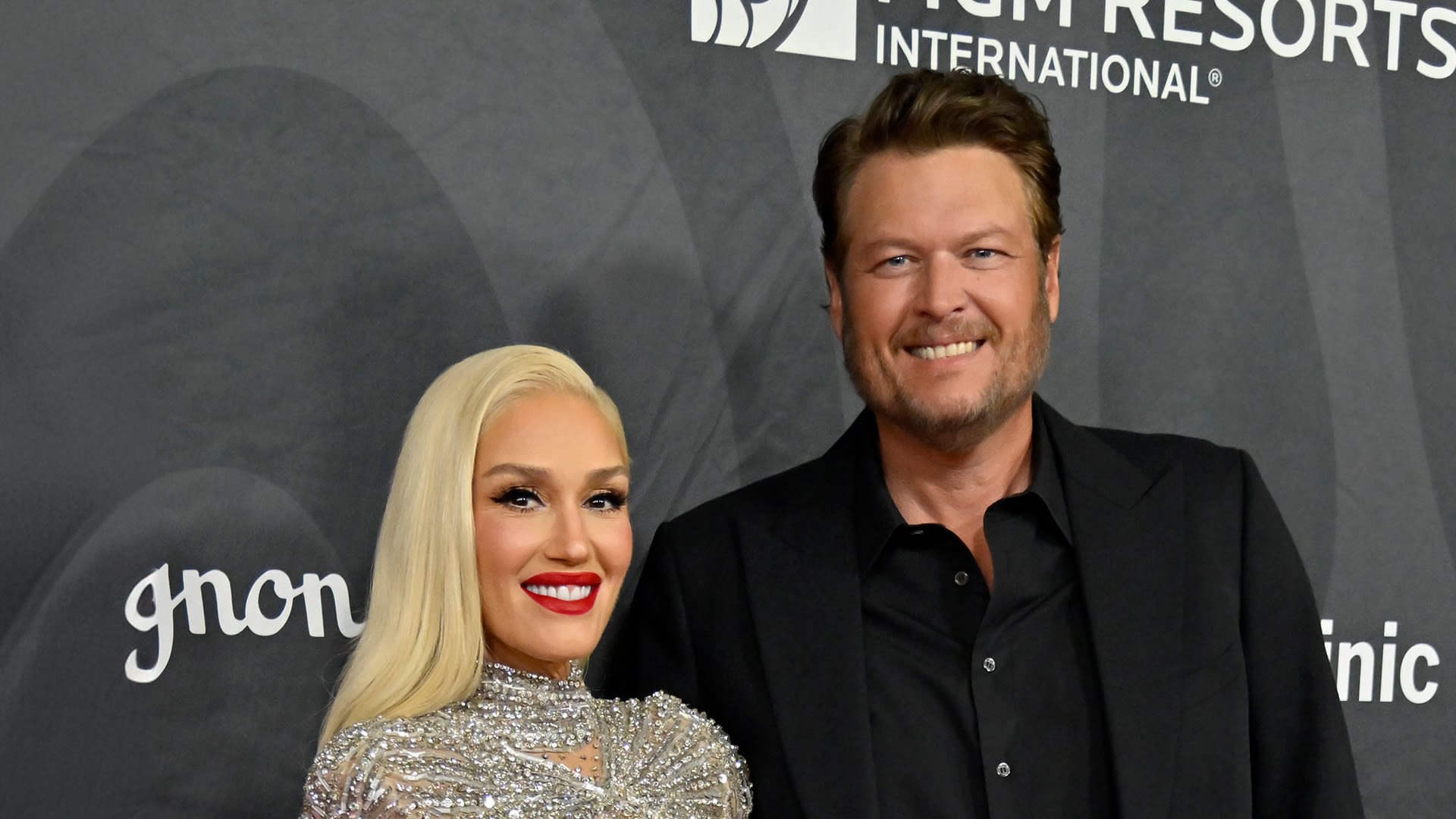 Gwen kisses Blake on stage at Vegas charity gala as she praises his ‘big heart’