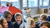 Nao, nao... Swiss children in a Lausanne creche have some fun with their new robot friend, Nao