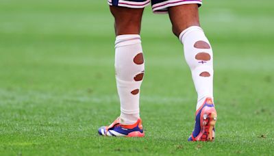 Why England stars cut holes in their socks as Bellingham leaves fans baffled