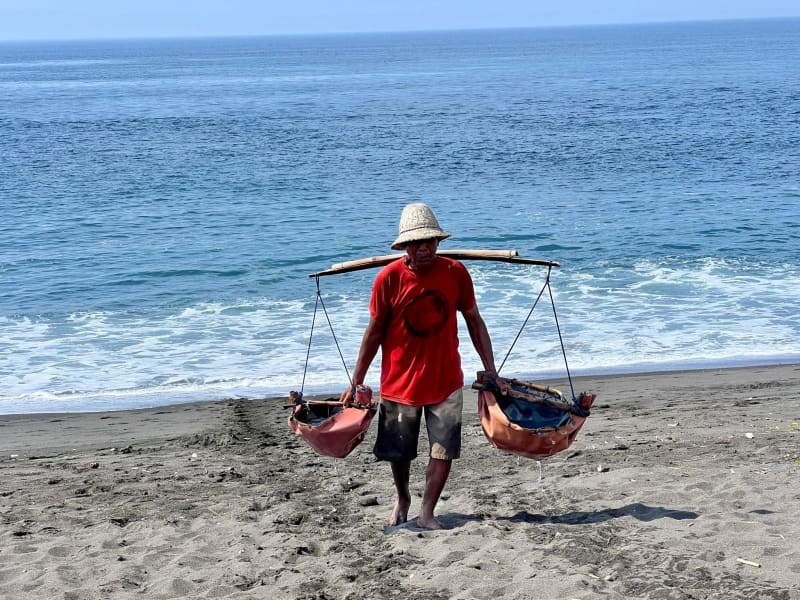 Bali's last salt farmers reveal 'white gold' in dark sands