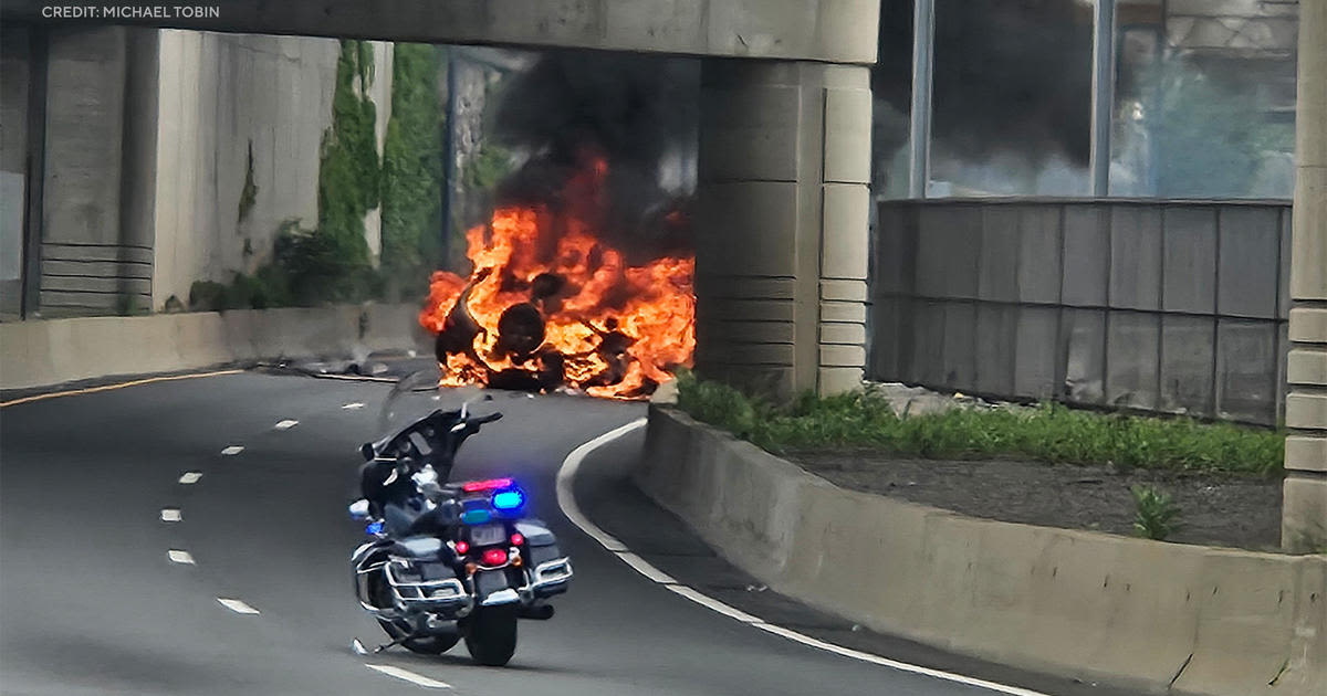 Driver killed as burning SUV crashes through fence, falls 40 feet onto road in Boston