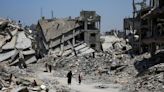 Bodies trapped in Gaza City under Israeli assault as mediators seek truce