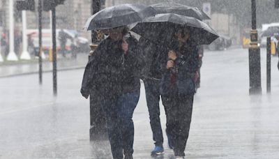 Return of the summer washout: UK braces for flooding and travel chaos as Met Office issues weather warnings