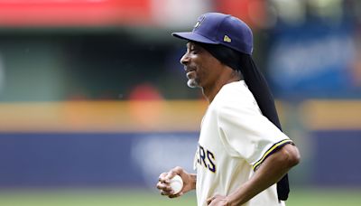 Snoop Dogg Throws First Pitch & Offers Hilarious Commentary at Brewers vs. Reds Game: Watch