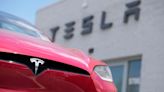 Tesla faces an identity crisis: carmaker or tech firm?
