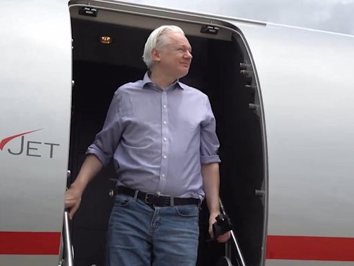 Julian Assange disembarks plane in Bangkok after leaving London