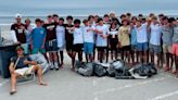 Portsmouth boys soccer team cleans up trash and debris from Jenness State Beach