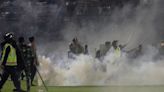 Indonesia football disaster: At least 125 killed after riot and stampede at match as tear gas fired