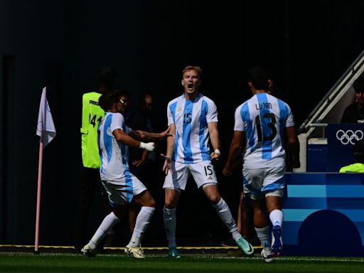 Argentina off the mark with win over Iraq; Spain through after victory