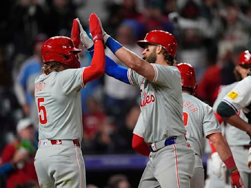 Bryce Harper hits a 3-run homer in Phillies' 9th-inning rally to beat Rockies 8-4