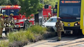 Car struck by train in South LA's University Park, minor injuries reported