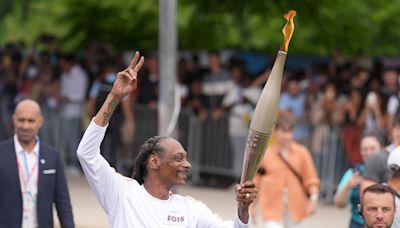 Snoop Dogg & Pharrell Carry Olympic Torches in Final Stretch of the 2024 Relay: Watch