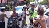 ‘You want to steal money!’: Shirtless, tattooed American bro challenges Bali cops after he was stopped for not wearing a helmet | Coconuts