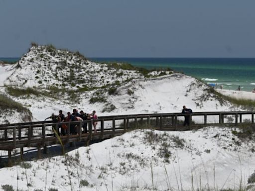 Popular vacation spot for Louisianans shuts down beach after two shark attacks injure woman, teen