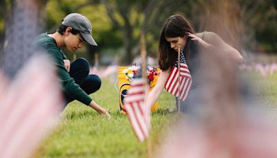 Loved ones attend to graves at Los Angeles National Cemetery ahead of Memorial Day